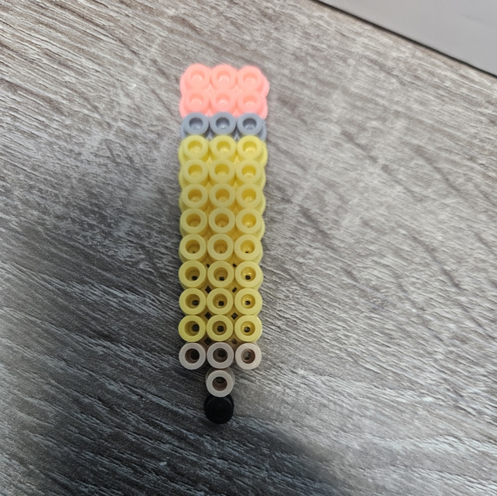 Pencil magnet made out of perler beads.